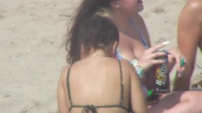 Hot babes on the beach have a good time