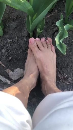 Melove with Her Small Feet Outdoor in the Garden