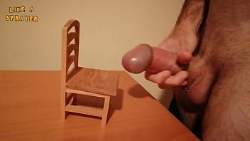 Handjob and cumshot on a small wood chair