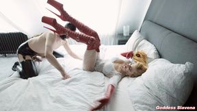 A sexy, natural redheaded ginger is performing CBT and dominating in bed while wearing red boots