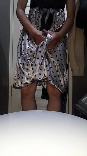 Captivating moment from "Crossdresser Cum Wearing Satin Silk Polkadot Dress with Silky Lining"