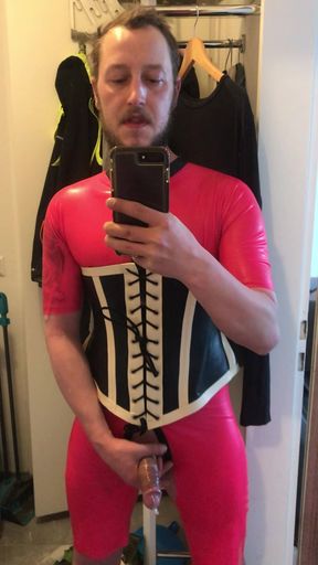 Latex fetish Benjamin Fiegl from Nuremberg jerks off in pink latex dressed with tight corset and condom his cock I&#039;m waiting for horny cocks that want to fuck me and squirt in my ass