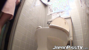 Japanese women piss in a bathroom with an up close camera