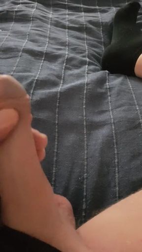 I lay and caress my cock and jerk off it longs