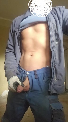 Skinny craftsman pisses on the construction site