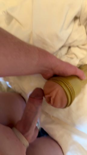 Man shows off his thick cock with a fleshlight cockring