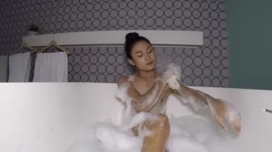 Nonny, A Small Asian Ladyboy Teen, Takes A Soapy Bath Before His Anal