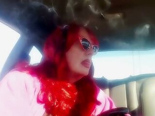 Mature Redhead Wearing LeatherGloves -Holder Smoking VS120 in Car