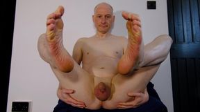 Nude man shows his small flaccid uncut penis, ass hole and feet for your judgment