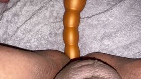Taking a long butt plug