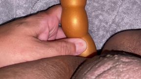 Taking a long butt plug