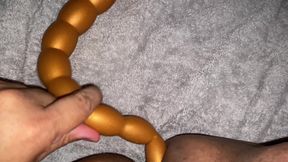 Taking a long butt plug
