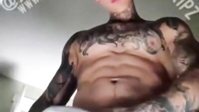 Beefed inked guy films his hot body and hard cock while masturbating
