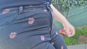 very rare and expensive jeans pierced by a rusty nail