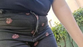 very rare and expensive jeans pierced by a rusty nail