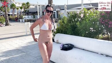 Busted naked in public big titted MILF flashes her tattooed ass