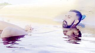 Homo-erotic exhibitionist strokes inwards a lagoon & has real orgasm in public