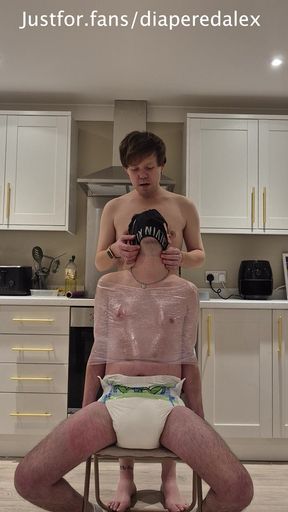 Diaper Boy Tied to a Chair