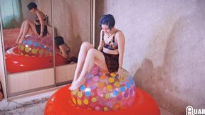 Q689 Stasia pumps 48'' beach ball under her to pop - 1080p