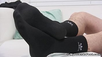 Solo amateur Jackson jerks off his cock while showing feet