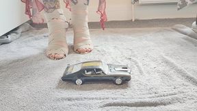 Giantess Jayne crushes toy car Oldsmobile in snakeskin heels ground view