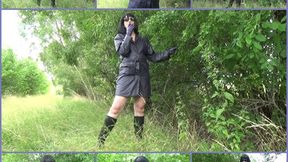 Mistress Angela smokes in purple leather gloves and coat