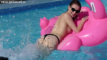 SCARLOT WET AND PLAYFUL IN POOL WITH TITS OUT LOOKING REAL SEXY HOT