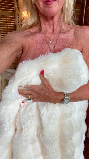 Blonde woman in white fur coat