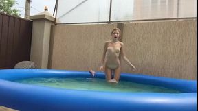 Petite Stepsister having fun in the pool and masturbates