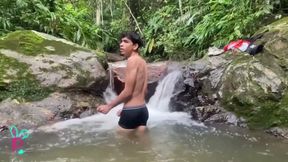 Latino masturbates in a waterfall and fills with milk