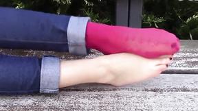 ”Brunette hot girl takes socks off & goes barefoot in the park”