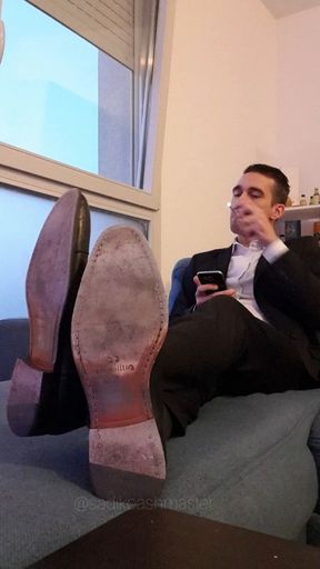 Your Boss smokes his cigarette on his sofa after work