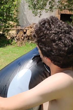 Beautiful Man Inflates His Inflatable Whale Near Pool Outside