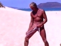 Tanned guy on beach in tiny string thong (temporarily!)