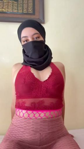 Muslim babe in hijab teases her round arab boobs while squeezing and jiggling her soft titties
