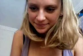 Lovable young blonde girl fingers her shaved vulva