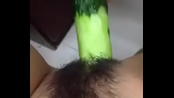 Teen Having Fun with a Cucumber