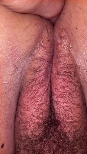 A lustful masseur caught the MILF off guard and licked her all over from behind, exploring her hairy pussy