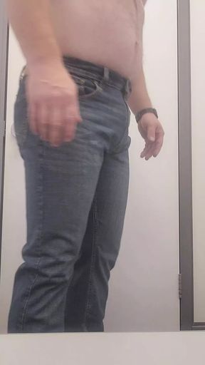 Trying on more clothes at the store.
