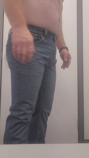 Trying on more clothes at the store.