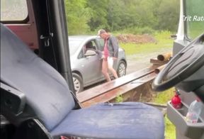 With the door open, I'm showing off. A pig drives by and stares at me.