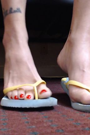 Toe wiggling in flipflops closeup