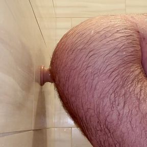 Anal Steve getting clean and down and dirty at the same time in the shower fucking a dildo making him moan and groan