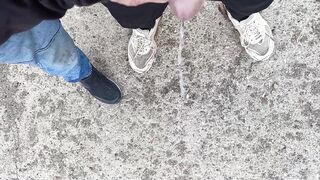 Buddy is holding my pecker while im pissing on the ground outdoor