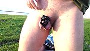Desperately peeing in chastity cage by lake