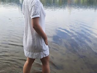 Delicate hotty. Nymph walks in a soaked transparent shirt