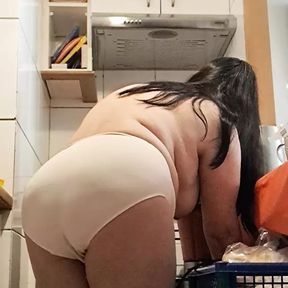 Mature milf in the kitchen cooking for stepson