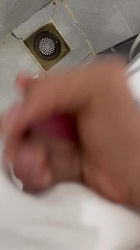 The young man escaped into the bathroom to relieve his needs.