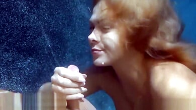 Fiery redhead girlfriend gives her boyfriend a deep underwater blowjob in the middle of the moonlit pool