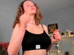 Redheaded pierced teen close up toy show